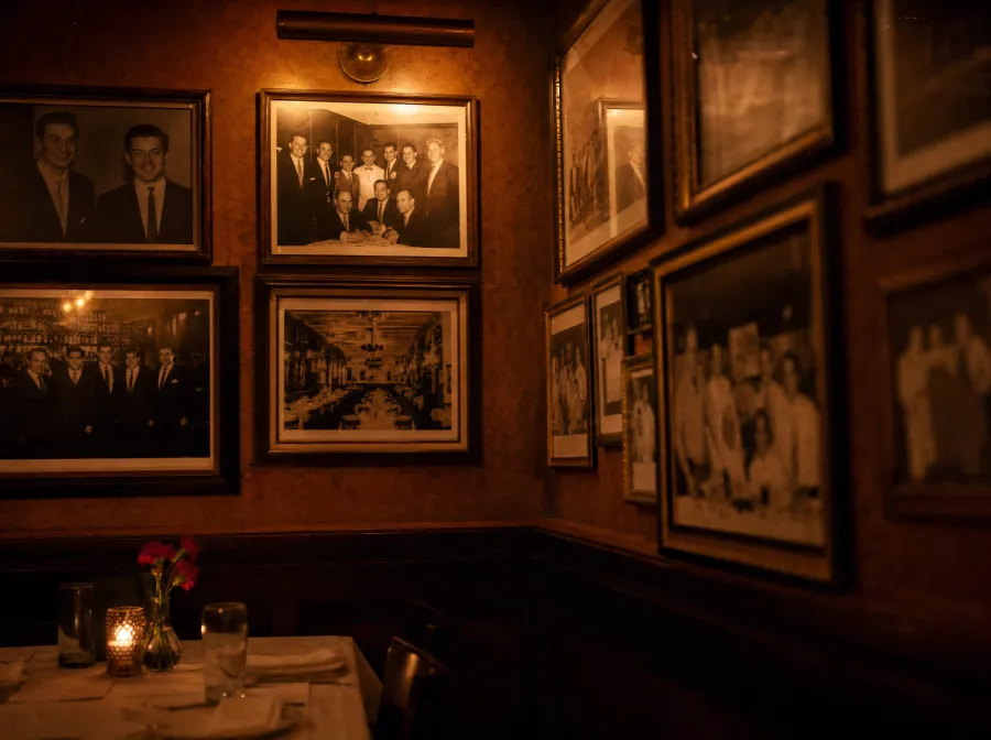 Walls lined with vintage family and restaurant photographs at GP's